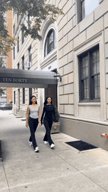 two models walking toward 1040 park ave
